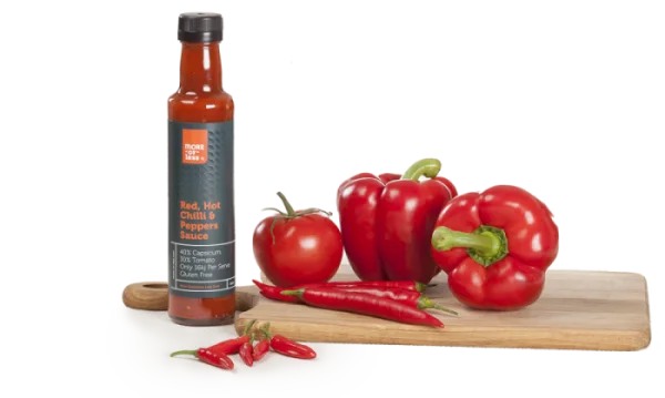 Hot Chili Sauce Bottle with Fresh Peppers and Tomato PNG