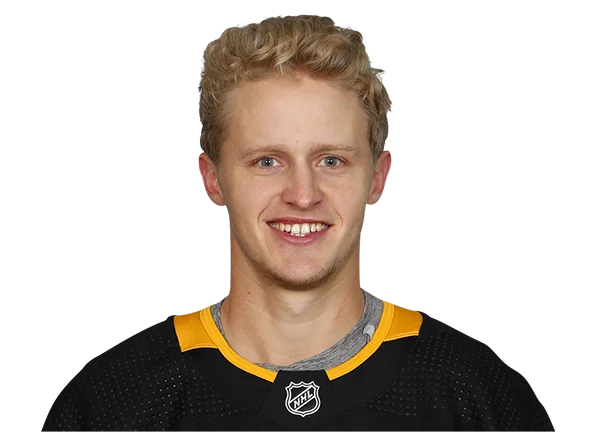 Young Male Hockey Player Smiling in NHL Jersey PNG